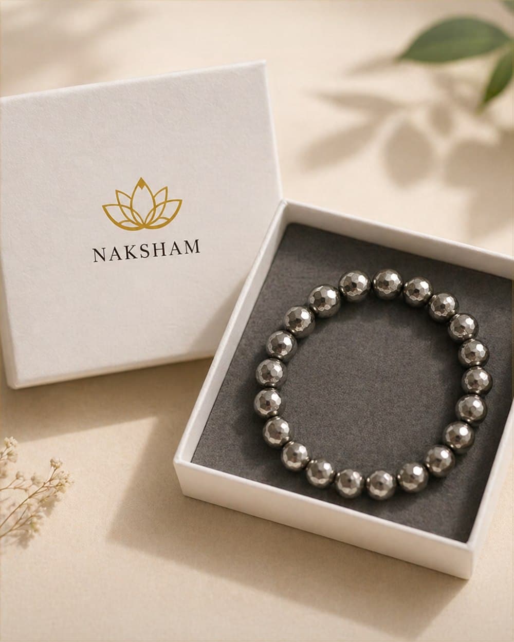 Naksham crystal bracelet of AAA-grade lab-certified stones, hand-strung on a natural cotton thread.