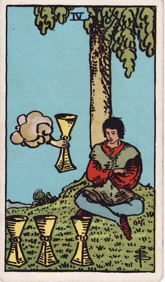 Four of Cups in the Rider-Waite-Smith deck, reversed